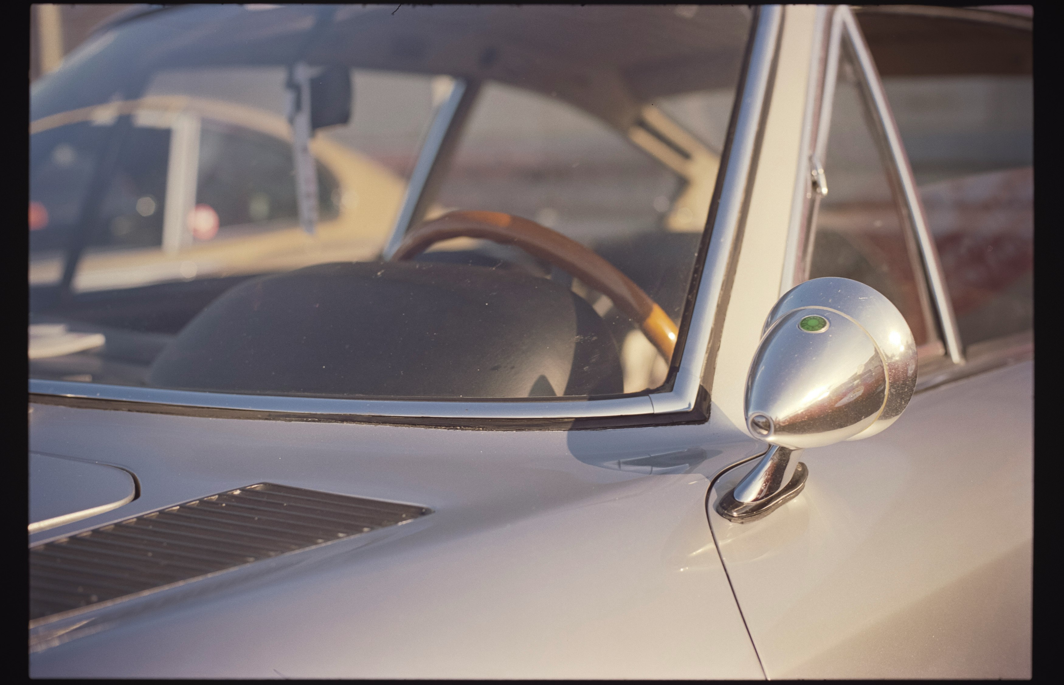 silver car with side mirror